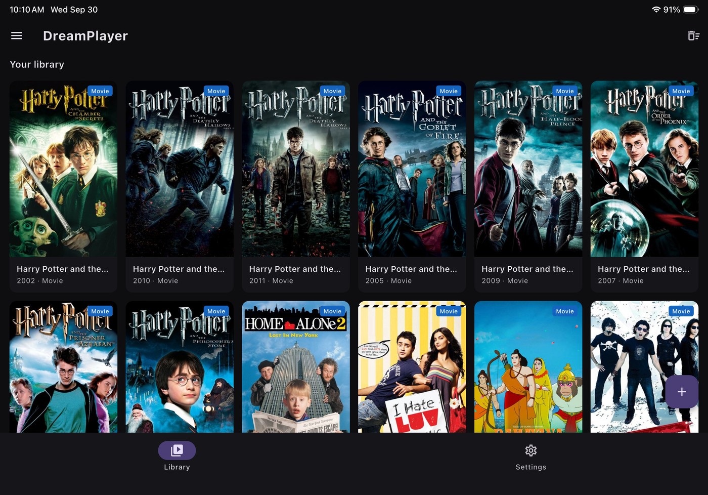 iPad library in landscape showing the poster grid with per-title artwork