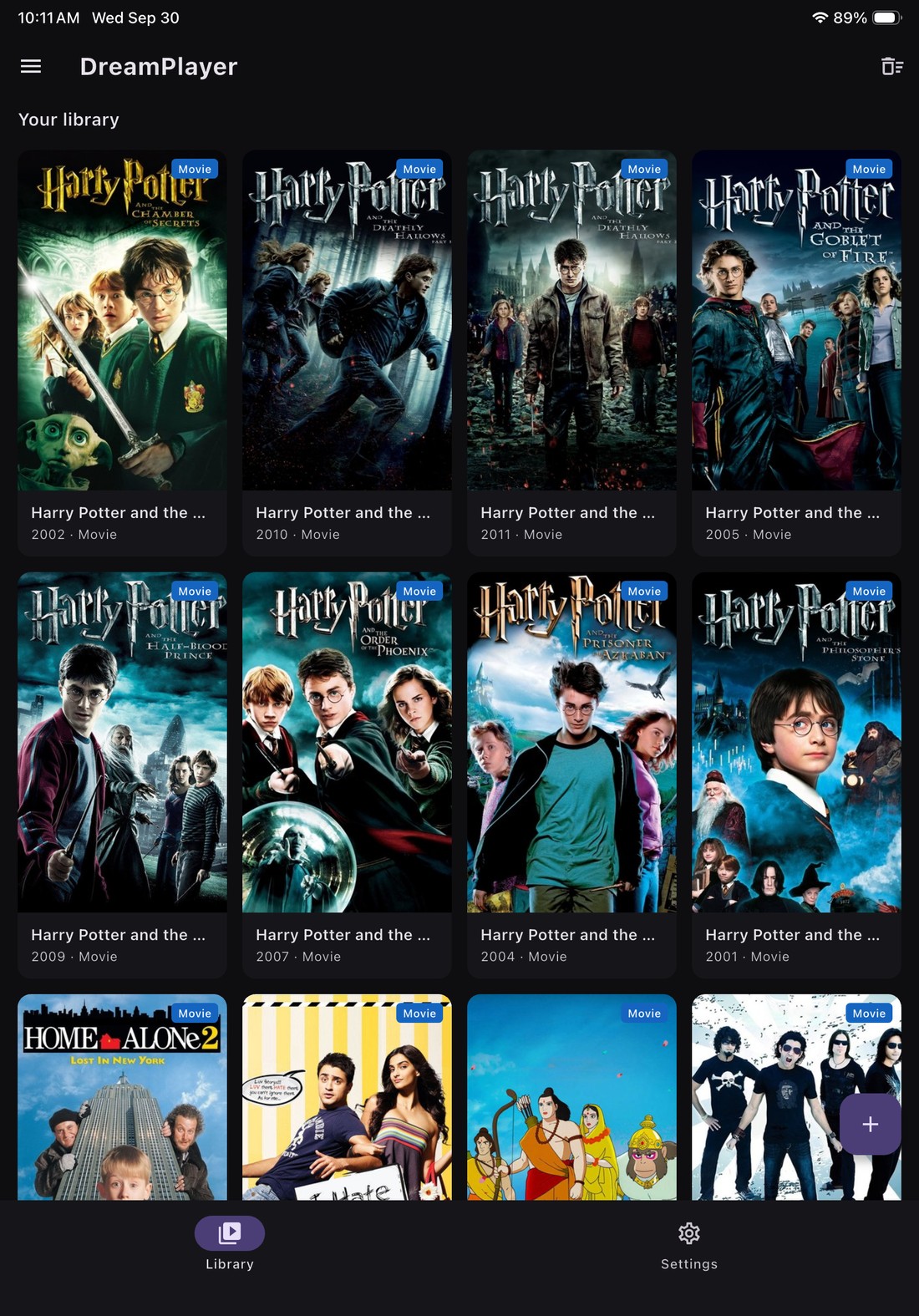 iPad library grid with poster artwork per title